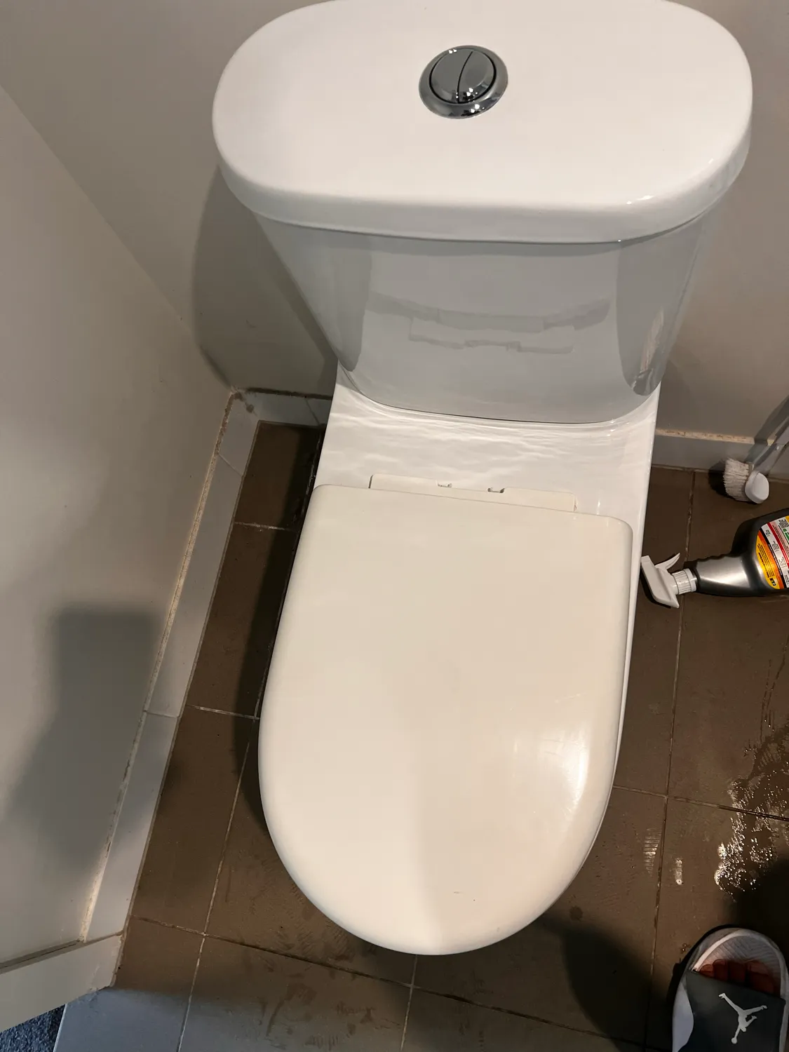 Toilet base and floor tiles after cleaning