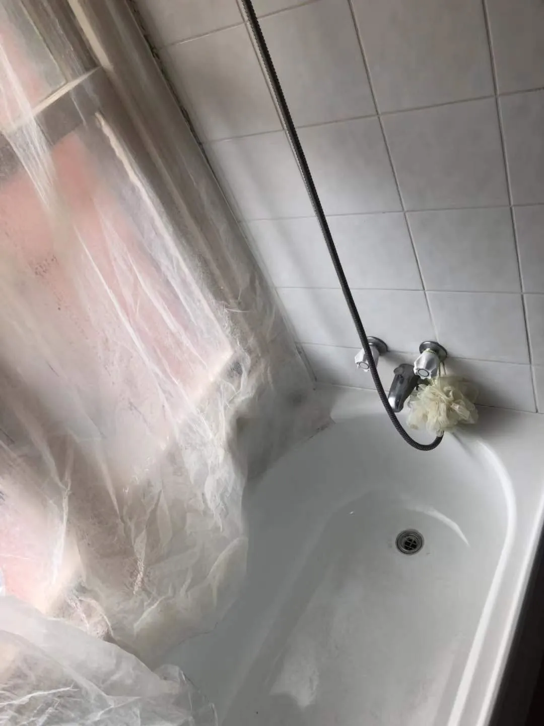 Bathtub tiles and taps after cleaning
